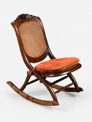 American Victorian Folding Cane Rocking Chair w/ Carved Rose Crest, c.1920's