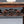 Italian Carved Mahogany Table w/ Foliate Scrollwork, Central Cartouche & Breccia Marble Top, c.1900’s