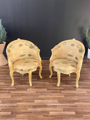 Pair of French Louis XVI Style Carved Chairs with an Antiqued Paint Finish