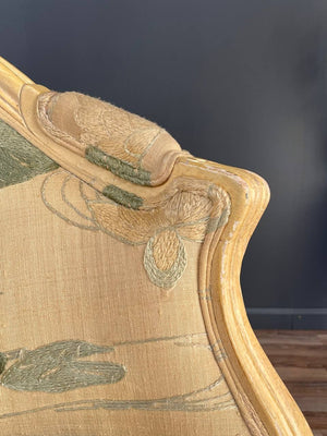Pair of French Louis XVI Style Carved Chairs with an Antiqued Paint Finish