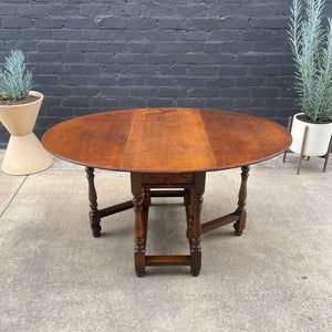 Antique American Style Oak Drop-Leaf Oval Dining Table