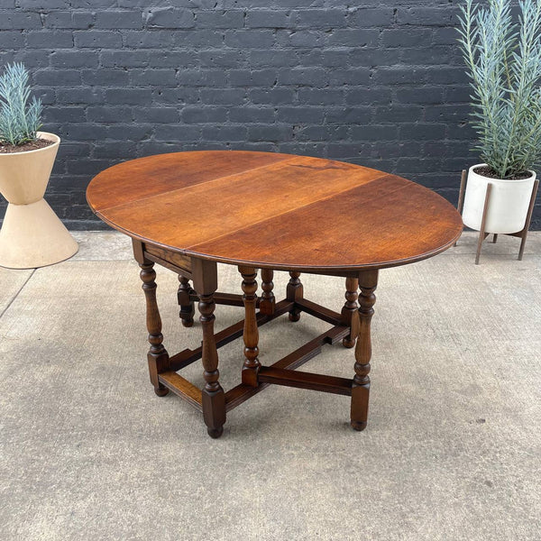 Antique American Style Oak Drop-Leaf Oval Dining Table